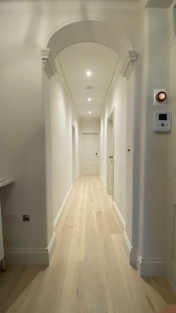Bright and sophisticated hallway after full flat refurbishment Kensington
