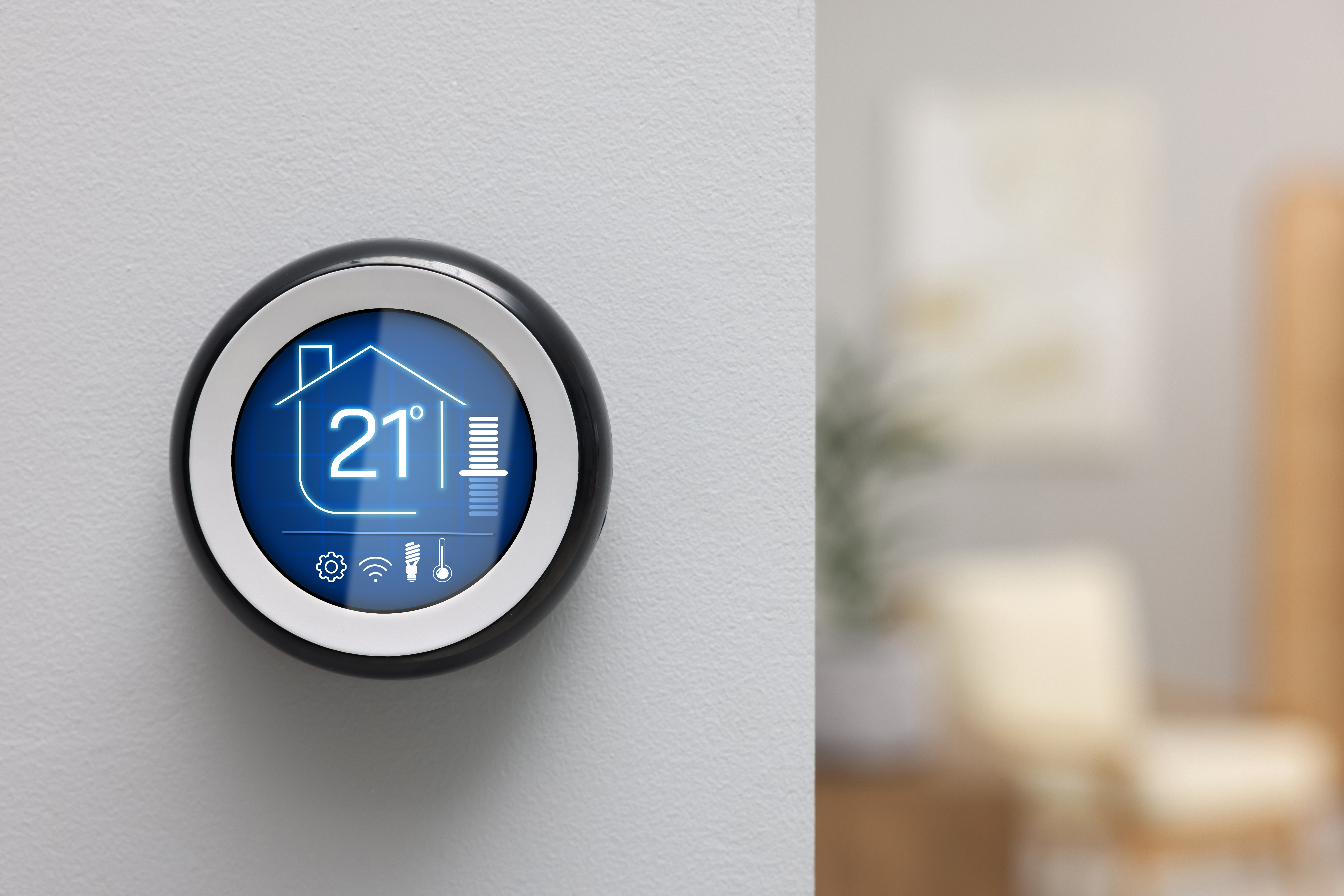 Professional plumber installing energy-efficient boiler in a modern Richmond kitchen, with smart thermostat