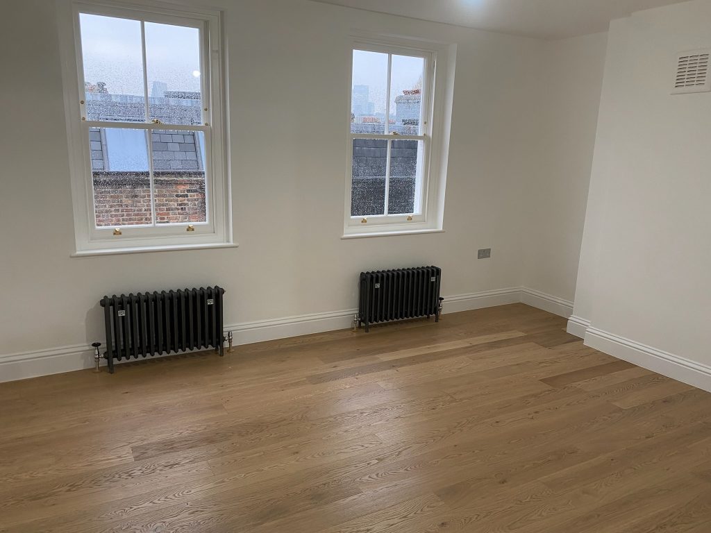 Freshly laid engineered oak flooring in newly refurbished room