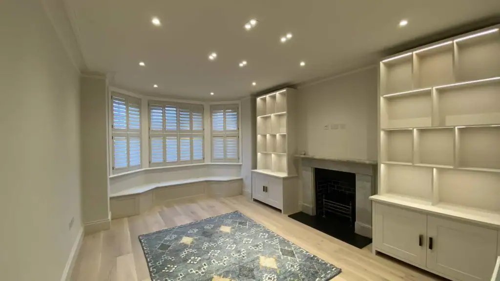 Kensington flat refurbishment with bespoke bookshelves and integrated LED lighting by LMDEC LTD
