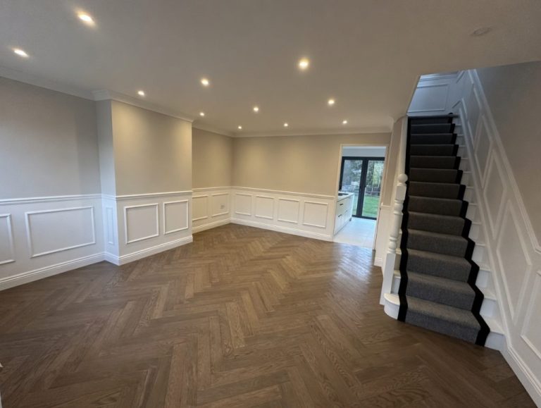 Large room with herringbone flooring and white panelling after full refurbishment in Selsdon CR2